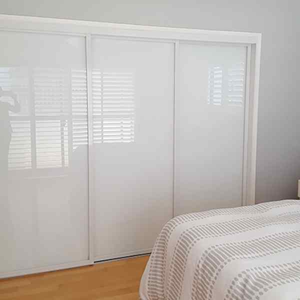 New White Glass Sliding Closet Doors in the Bedroom!