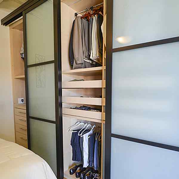 https://www.slidingdoorco.com/wp-content/uploads/loft-bedroom-closet-doors-storage-1.jpg